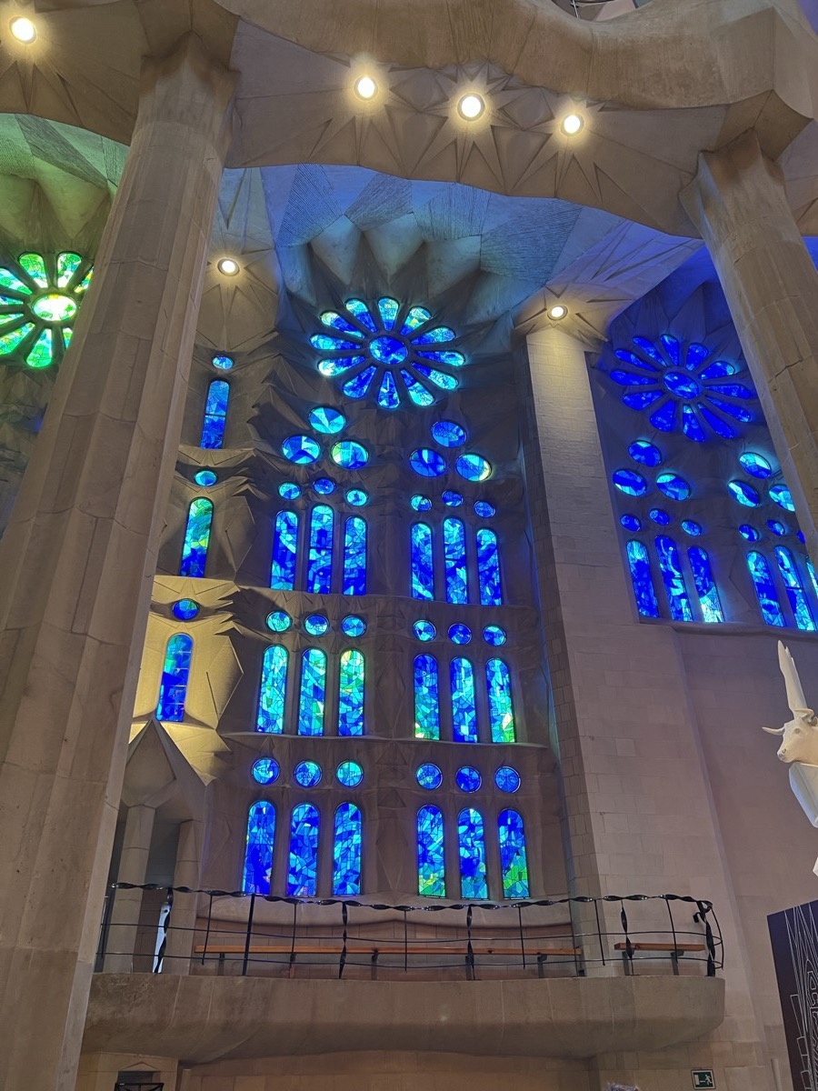 Blue and green stained glass windows inside Sagrada Família